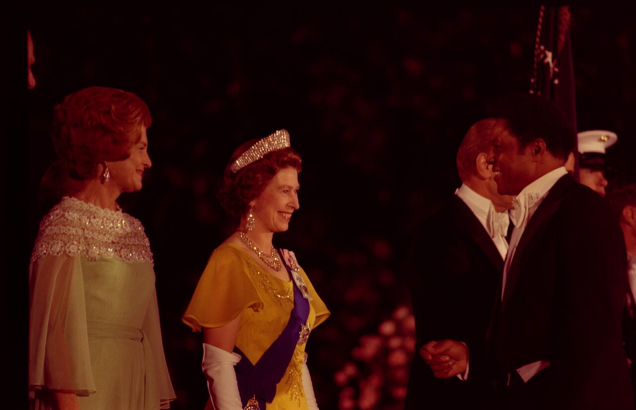 First Lady Betty Ford and Queen Elizabeth II of Great Britain Greeting Baseball Player Willie Mays in the Receiving Line on the South Driveway of the White House Prior to a State Dinner Honoring Her Majesty and Prince Philip