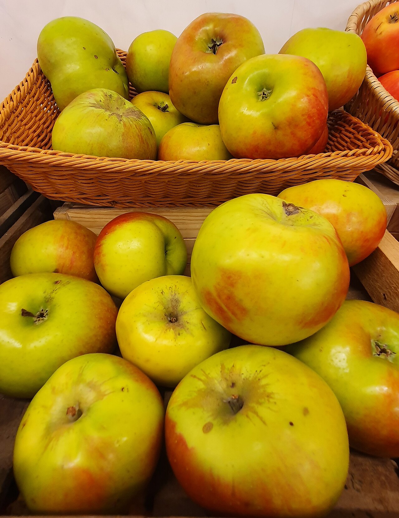 Bramley cooking apples, greengrocers display, Redruth, Cornwall - October 2022