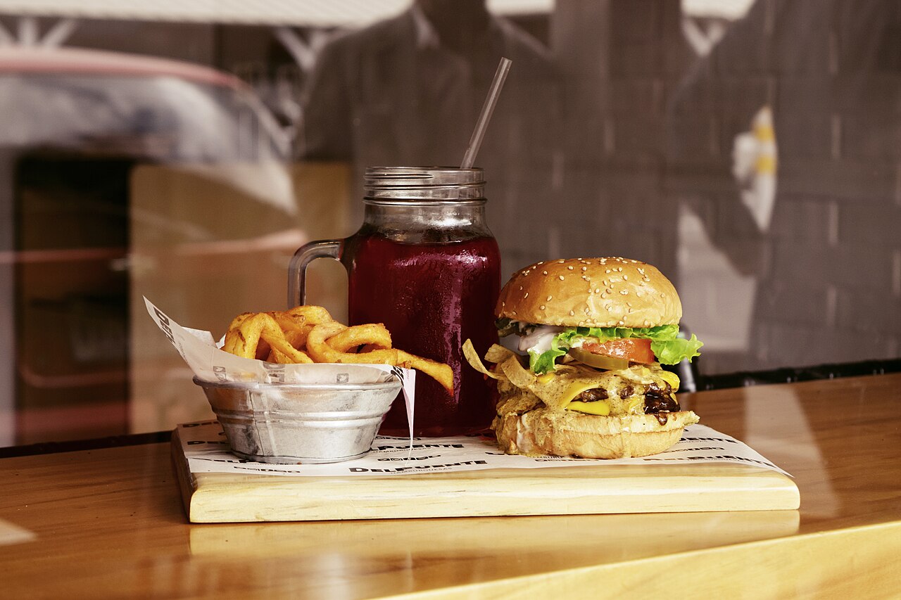 Burger, Fries, and Juice (Unsplash)