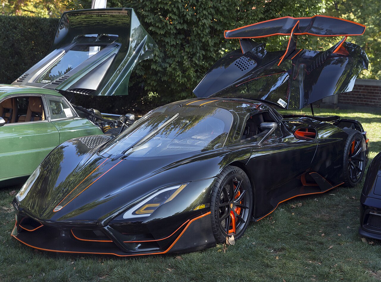 SSC Tuatara Striker in Dark Olive Green and Vibrant Orange, front left