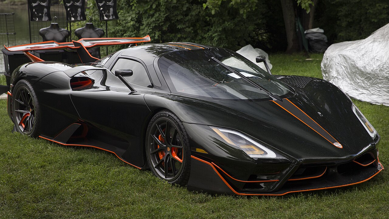 SSC Tuatara Striker in Dark Olive Green and Vibrant Orange, front right