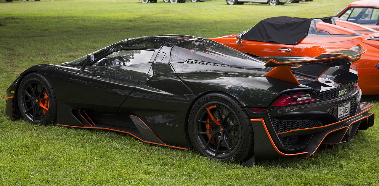 SSC Tuatara Striker in Dark Olive Green and Vibrant Orange, rear left