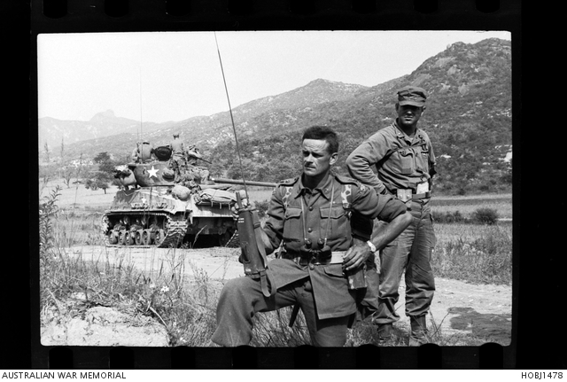 3RAR soldiers await the order to continue the advance north