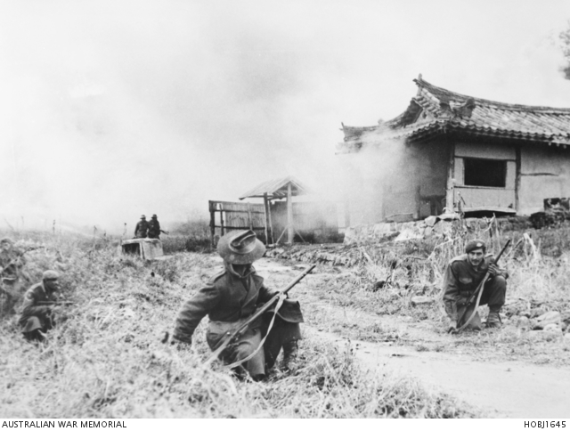 3RAR troops advance through Pakchon after an overnight battle