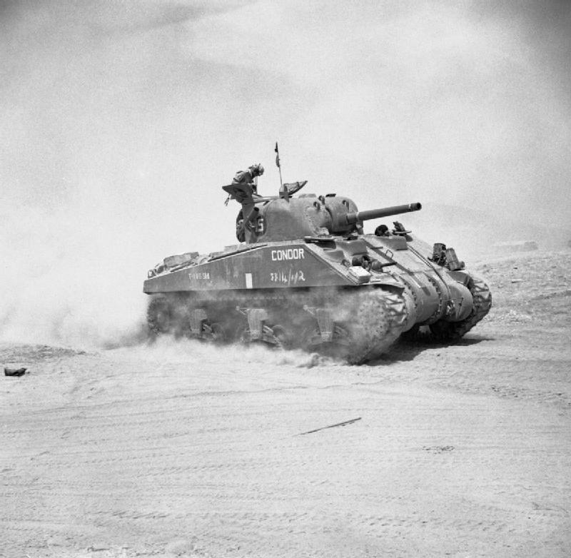 A British Sherman tank advancing near Catania, Sicily, 4 August 1943. NA5522