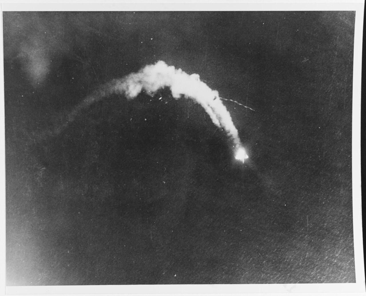 Kawanishi H8K2 "Emily" Flying Boat breaks up as it falls in flames after an attack by a PB4Y-1 of Bombing Squadron 115 (VB-115) in the Central Pacific, 2 July 1944